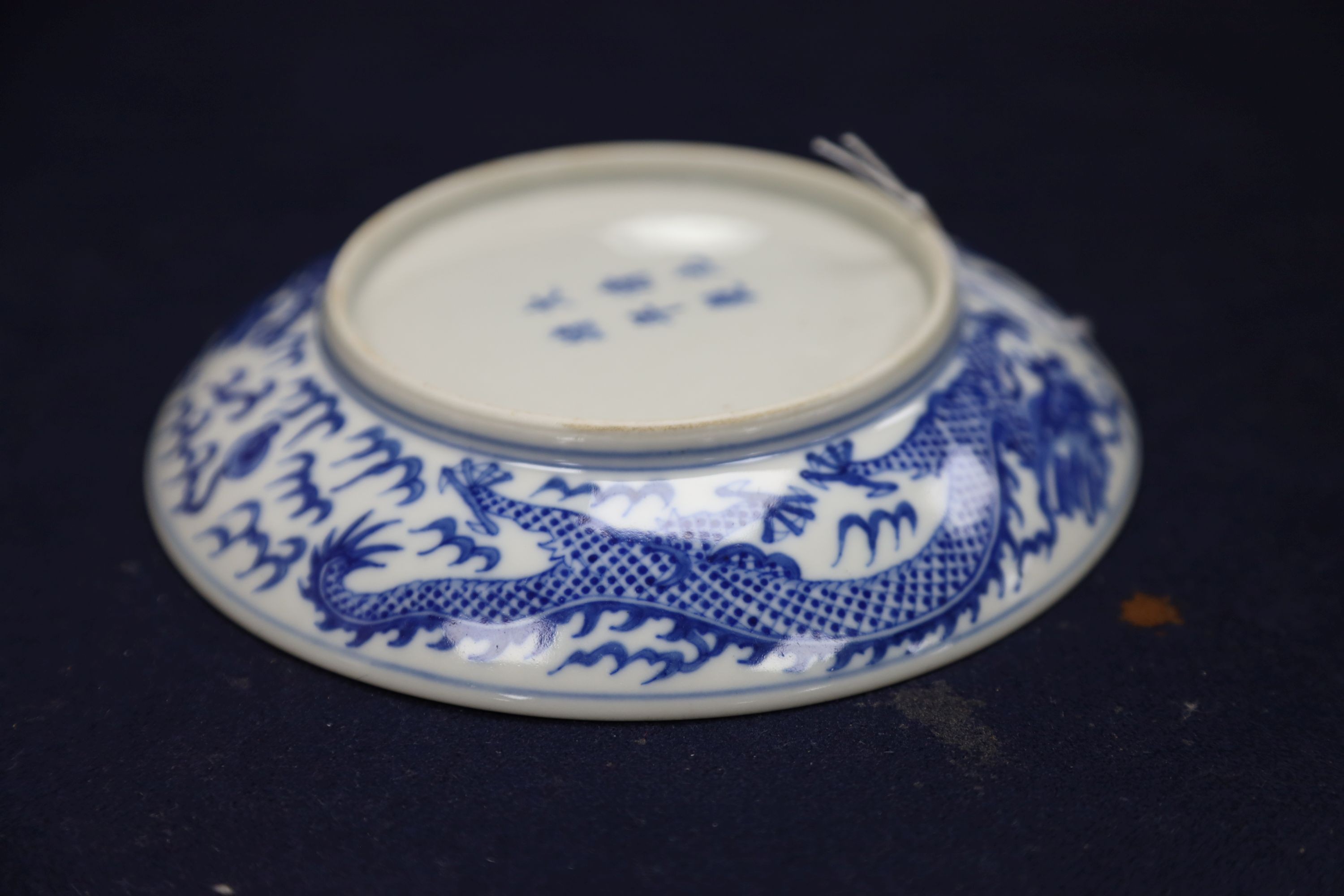 A Chinese blue and white landscape bowl, a/f and a Chinese blue and white 'dragon' dish, 18cm and 16.5cm